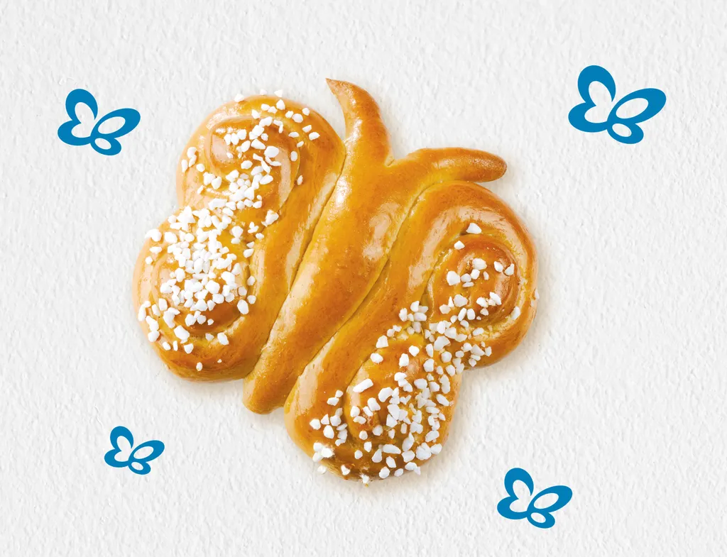 Ein Brioche-Schmetterling aus der INTERSPAR-Backstube auf einem weiß-grauen Untergrund