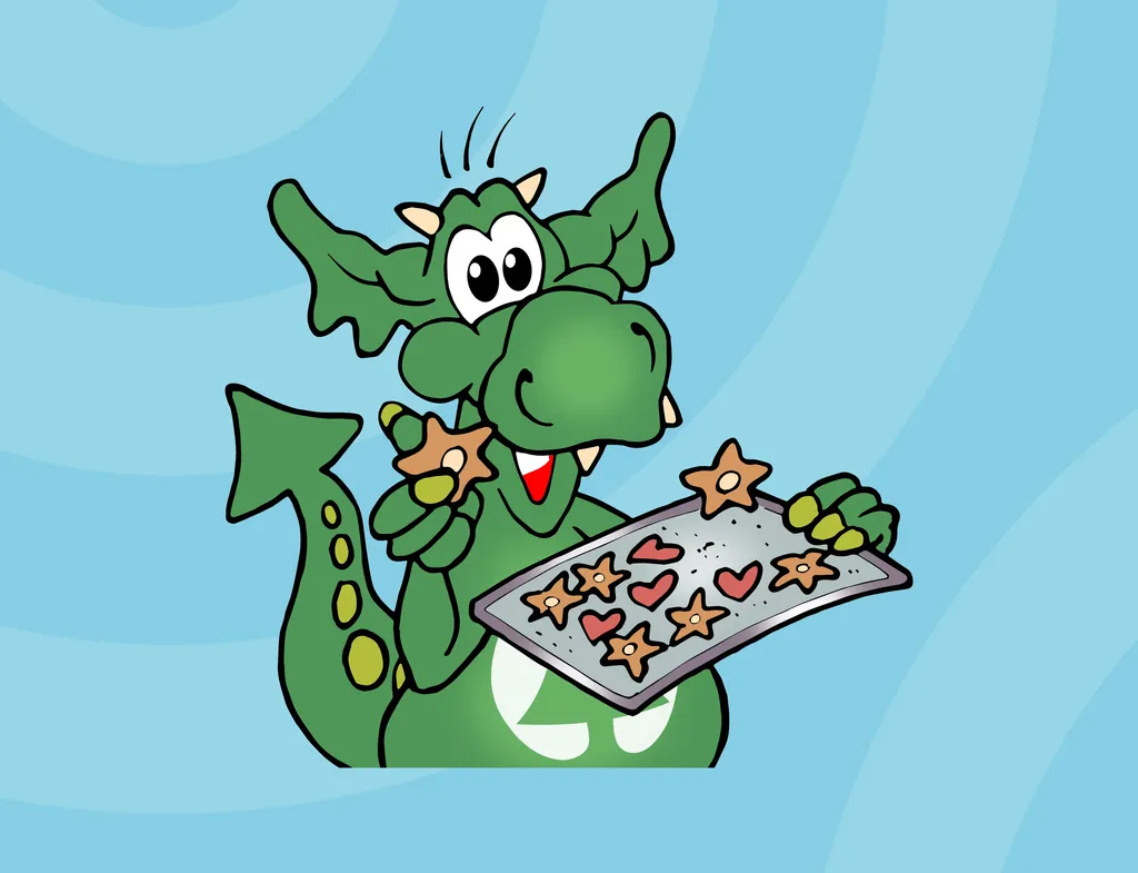 Der kleine grüne Drache INGO mit einem Blech frisch gebackener Kekse in den Händen