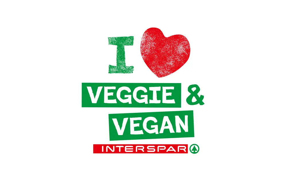 Logo mit dem Text „I love veggie & vegan“, einem Herz-Symbol und dem Schriftzug „Mit INTERSPAR“ in Rot und Grün, das für vegetarische und vegane Ernährung wirbt