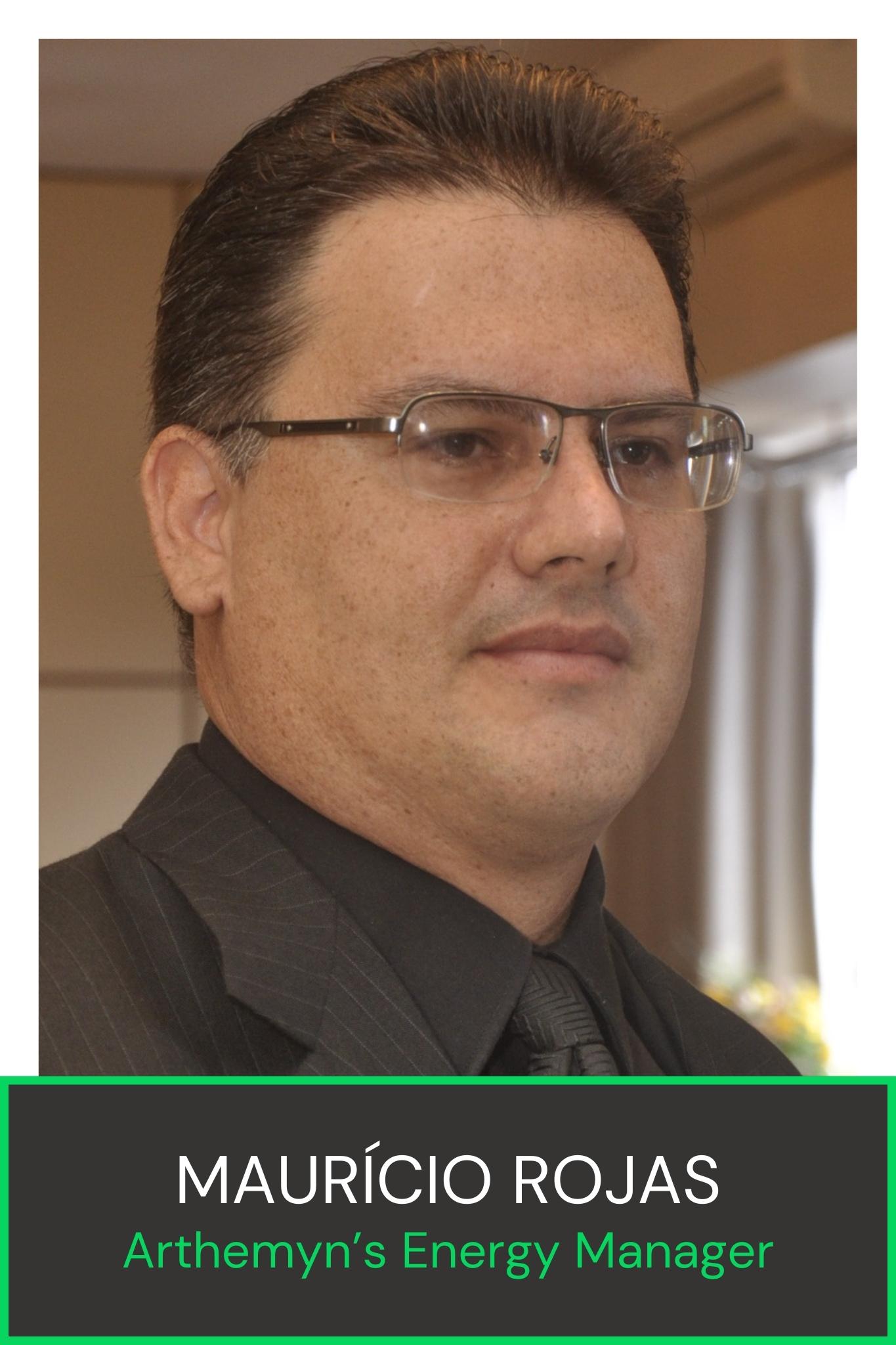 Man in glasses and a suit, labeled as Maurício Rojas, Arthemyn’s Energy Manager.