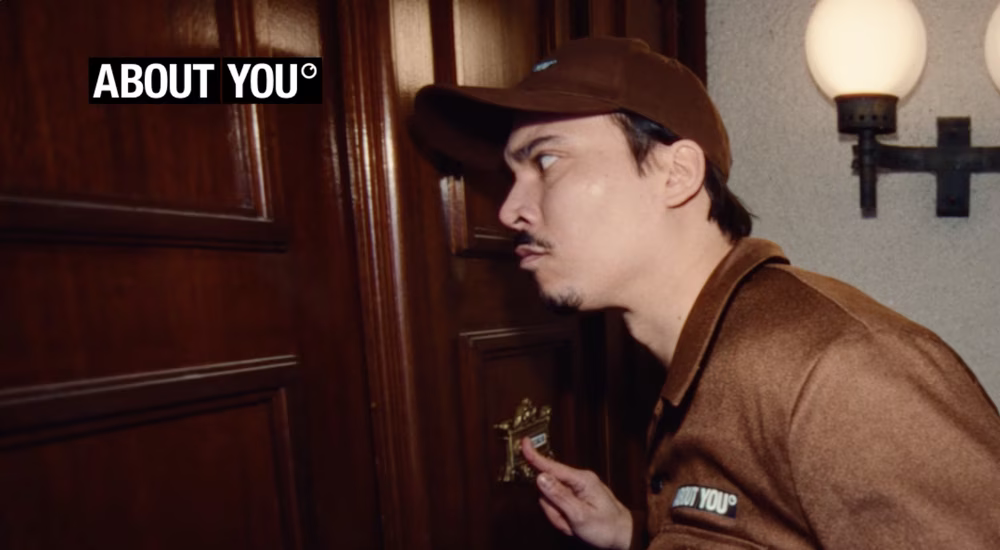 man with about you box rings doorbell