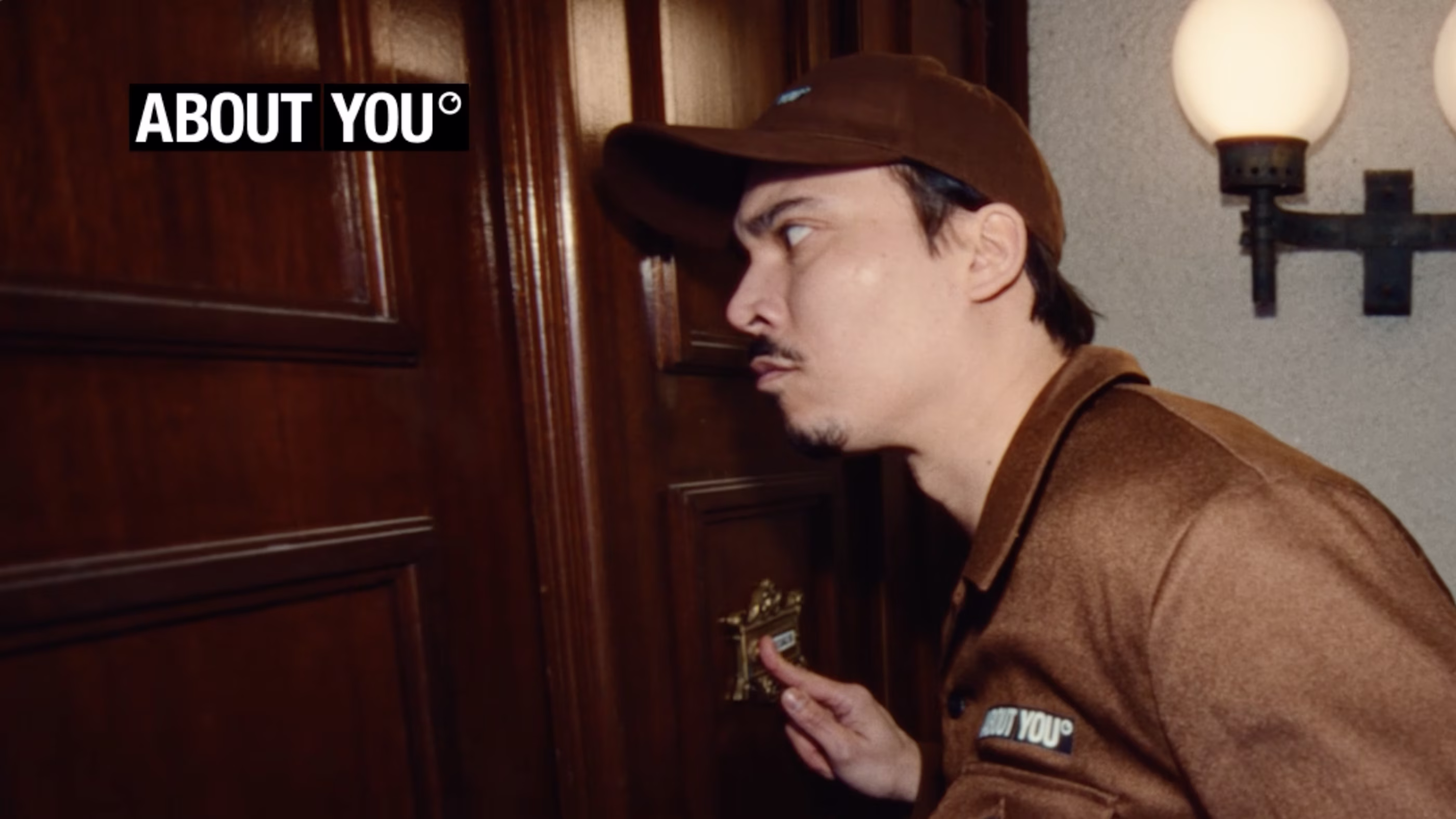 man with about you box rings doorbell