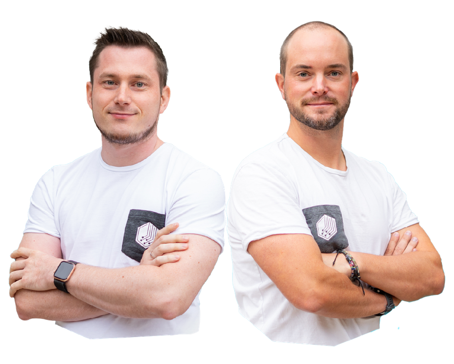 Two men with crossed arms wearing white t-shirts, standing side by side against a plain background.
