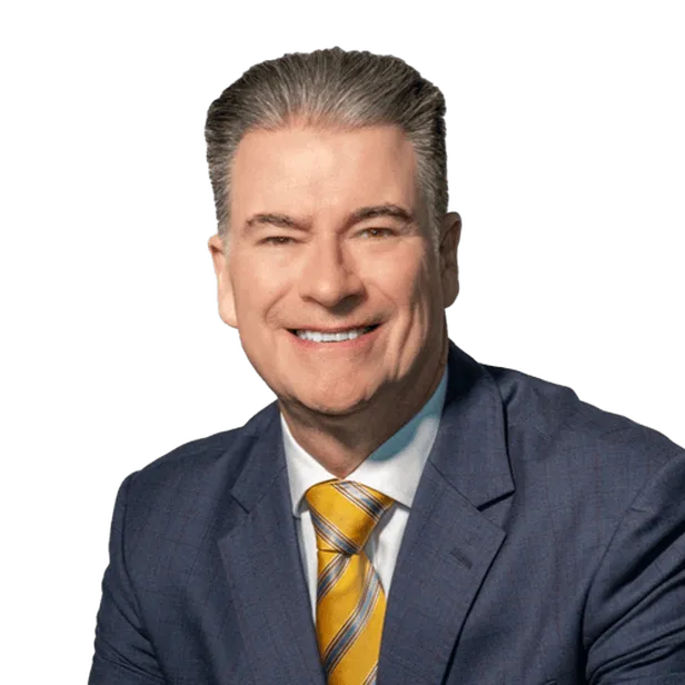 Smiling man in a blue suit and yellow striped tie.
