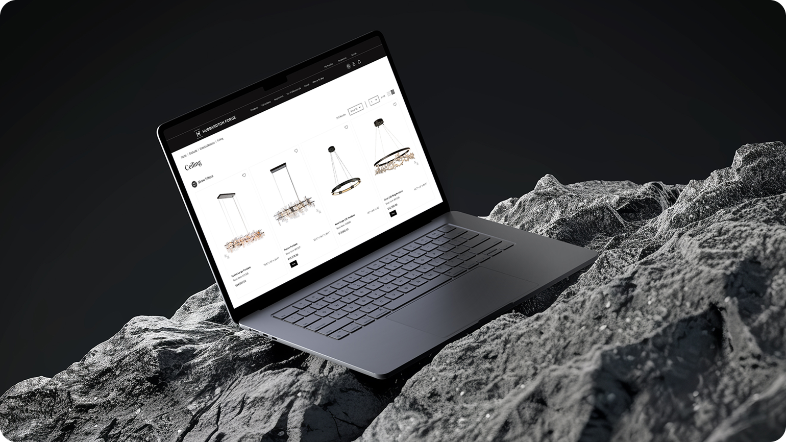 Hubbardton Forge product listing page showing ceiling pendant lights, shown on laptop