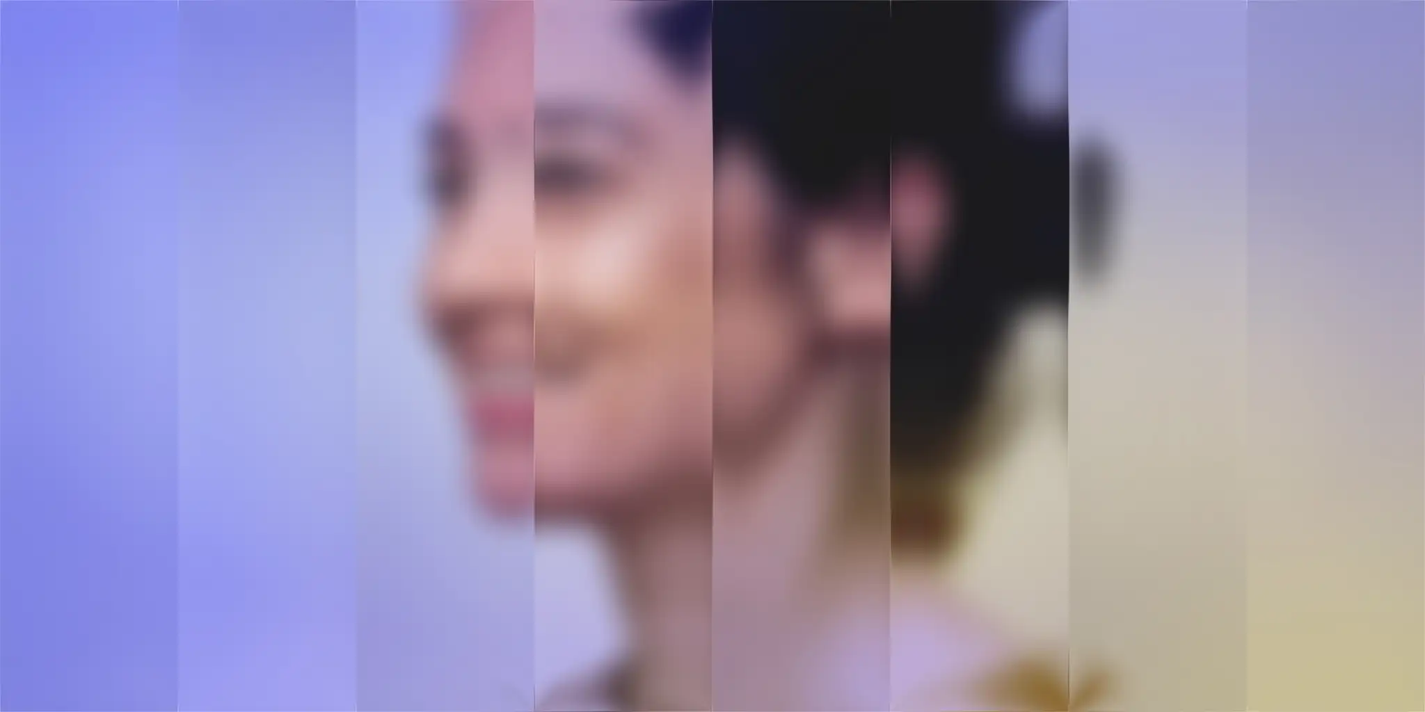 Blurry image of a smiling woman with dark hair, visible through vertical bands of different colors, creating an abstract effect.