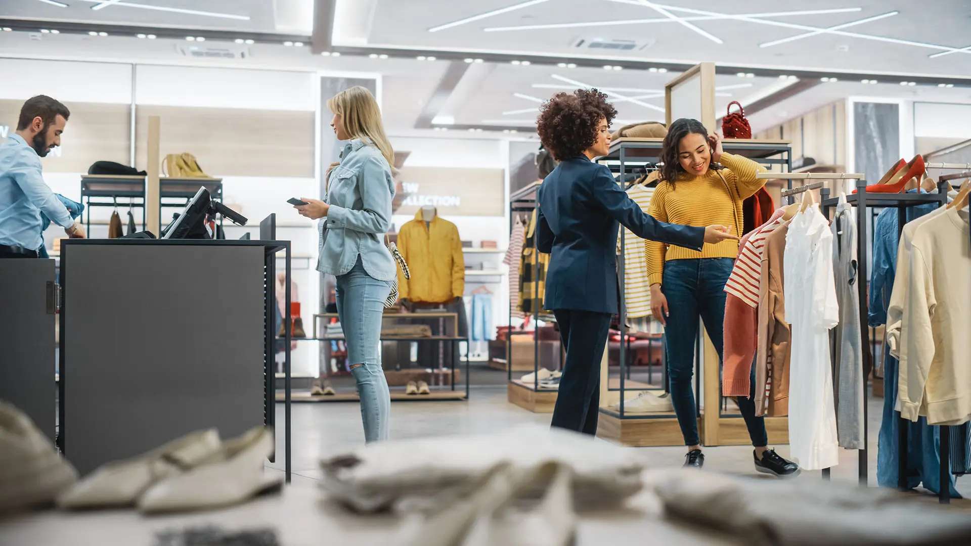 Customers shopping in a retail store and purchasing items