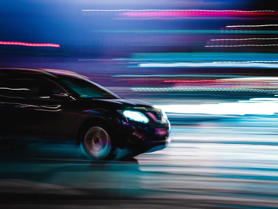 Car driving with bright lights