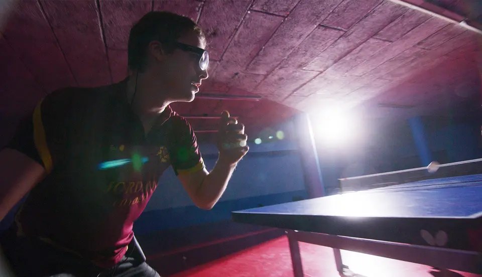 Person playing table tennis with Tobii Pro Glasses 3