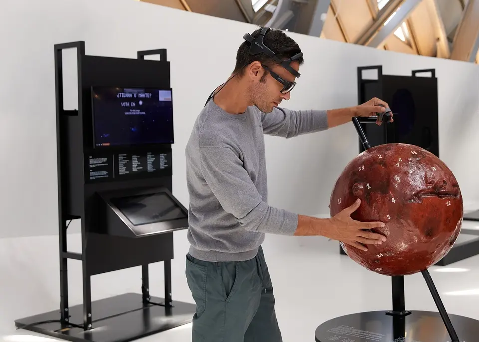 A man looking at science objects with Tobii Pro Glasses 3