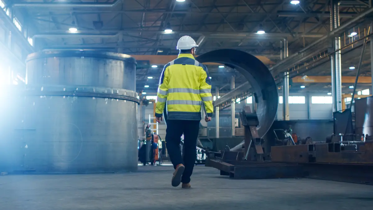A man is patrolling the plant.