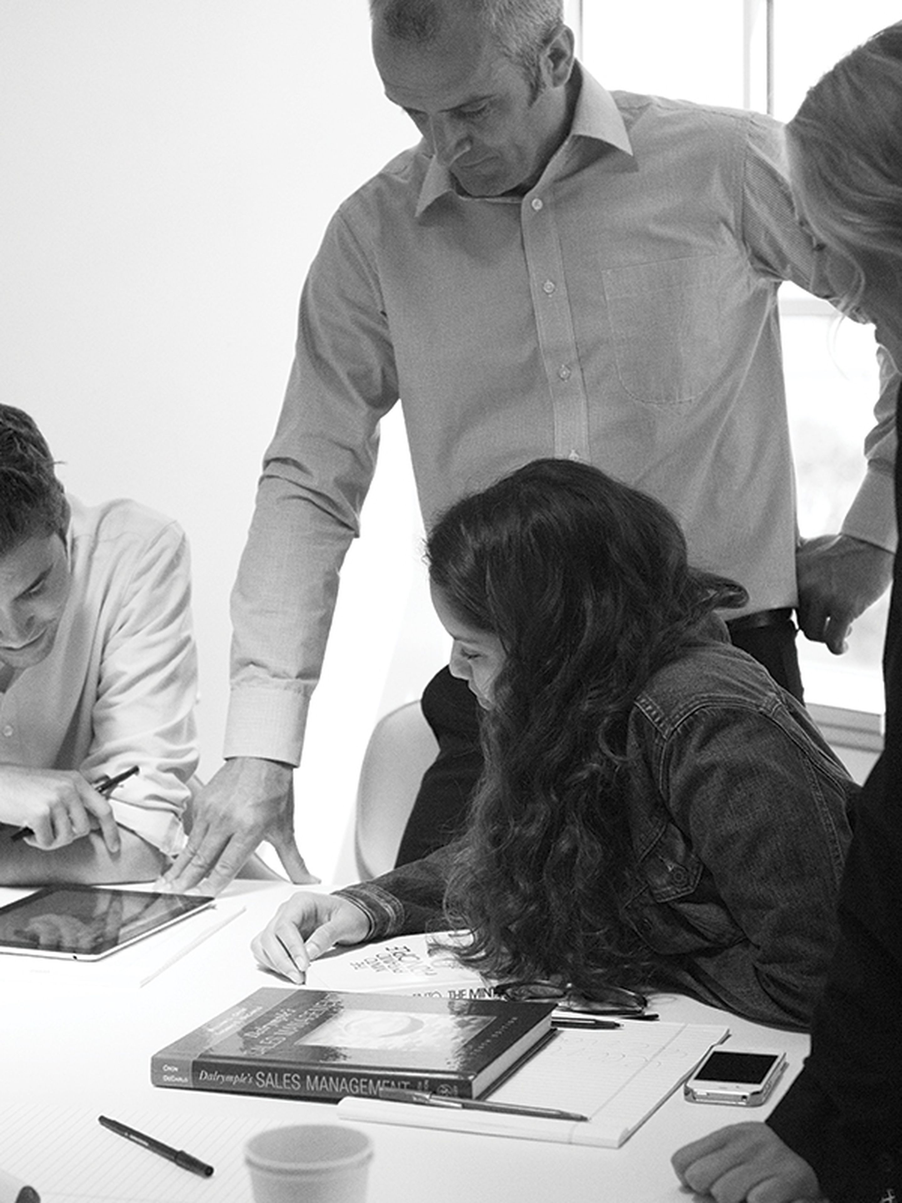Professor helping students with a project