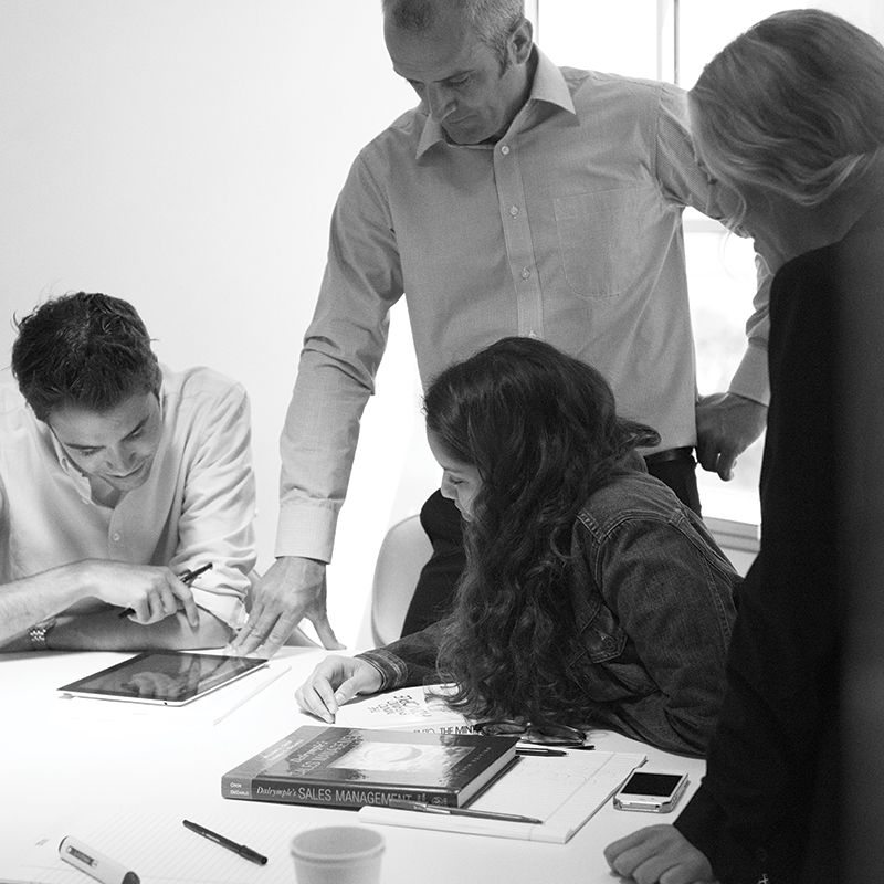 Professor helping students with a project