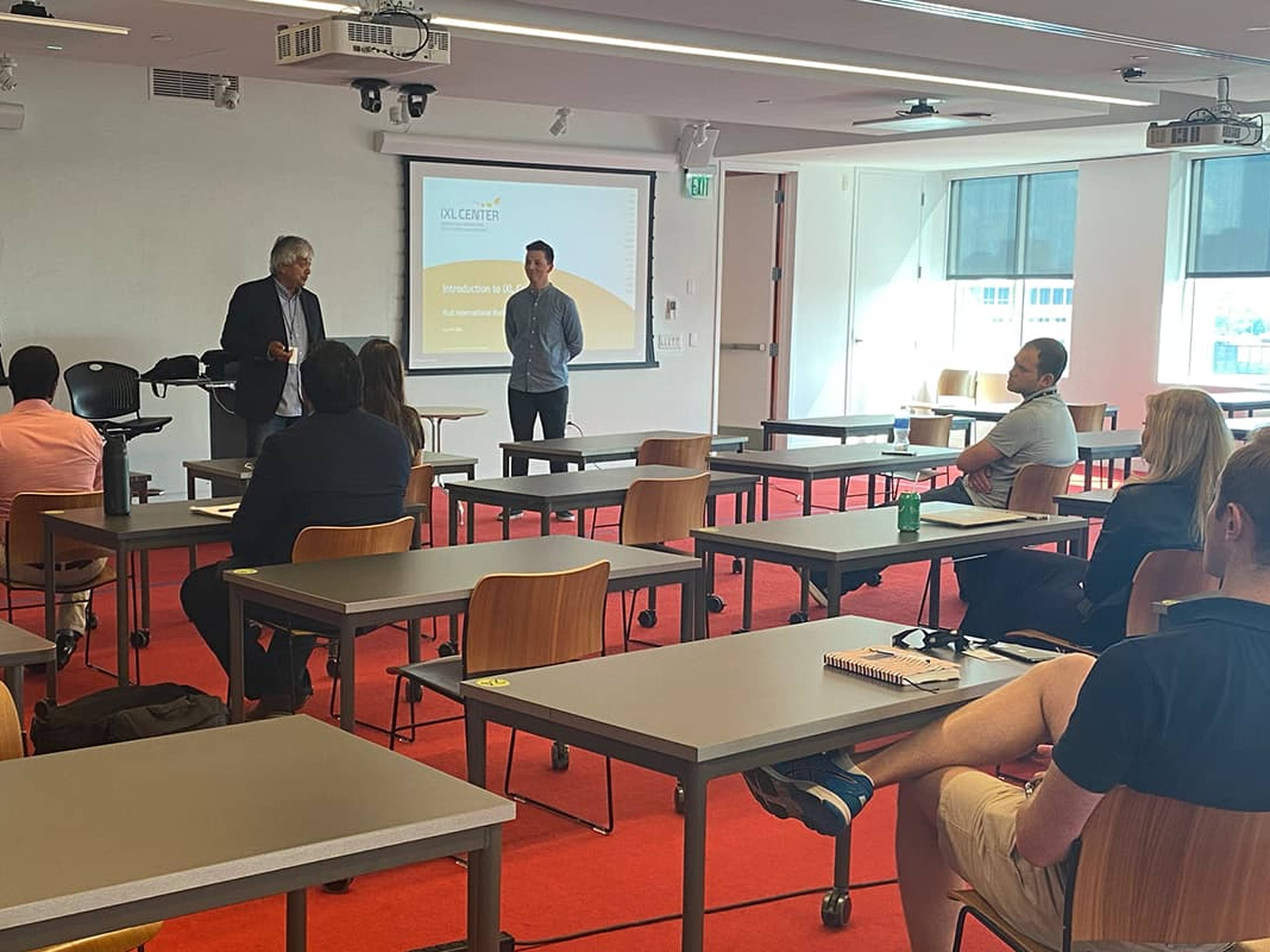 Instructor presenting to students in a classroom.
