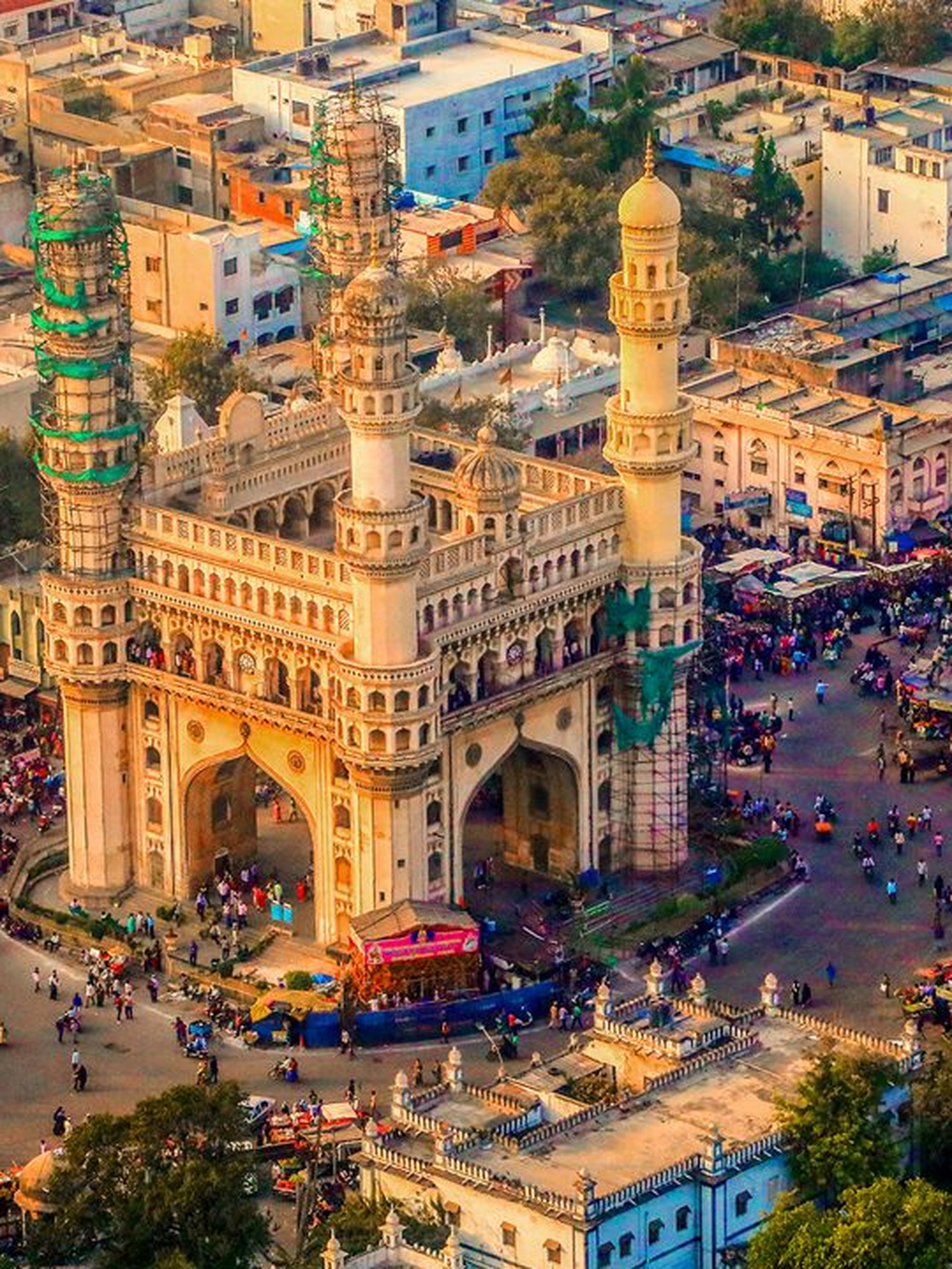 Aerial view of a busy urban area centered around an iconic historical monument.