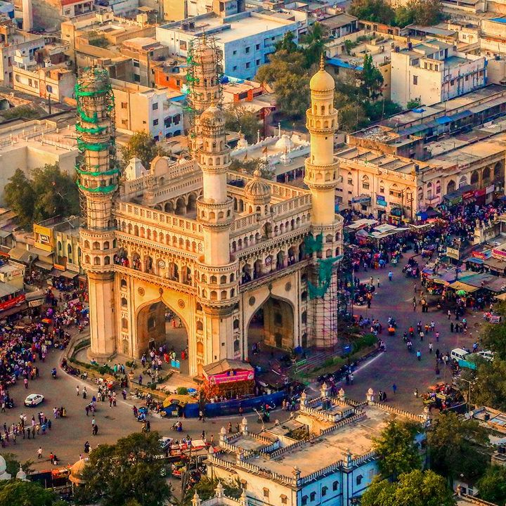 Aerial view of a busy urban area centered around an iconic historical monument.