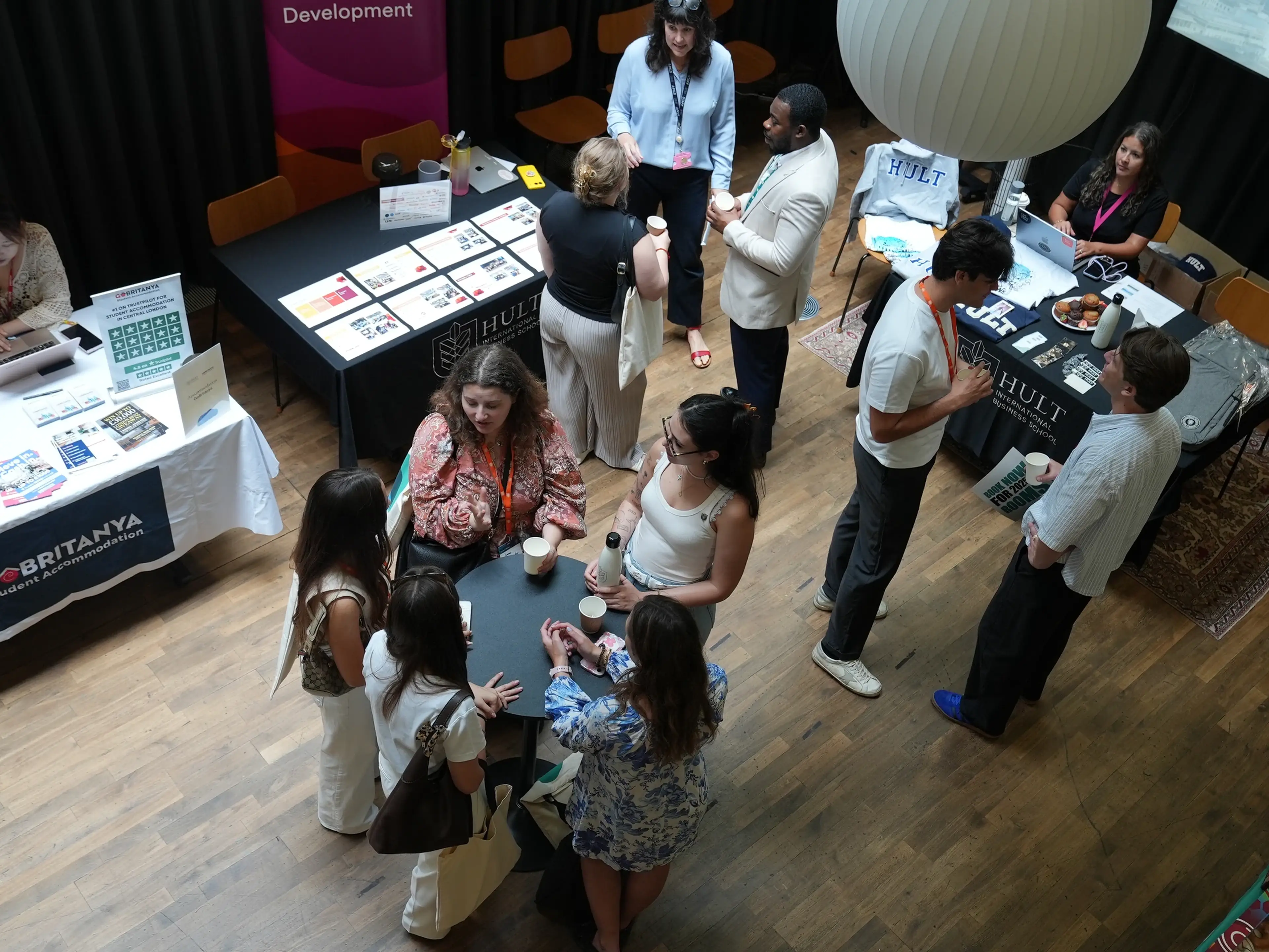 overhead shot of group around an exhibition table