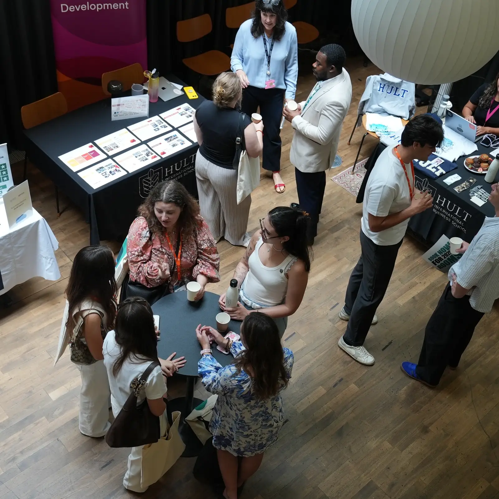 overhead shot of group around an exhibition table