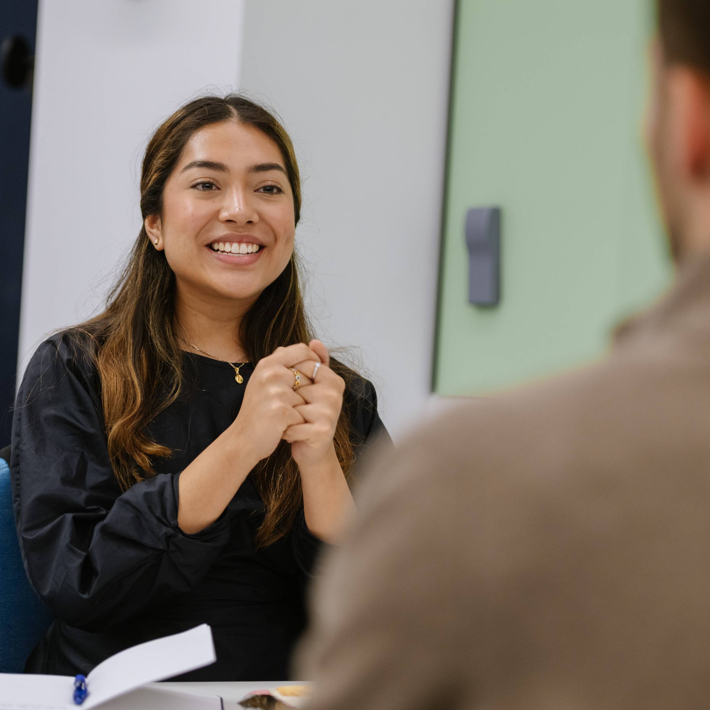 Hult student conversing with speaker at the Gartener company visit