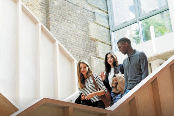 Hult BBA students on stairs in London campus