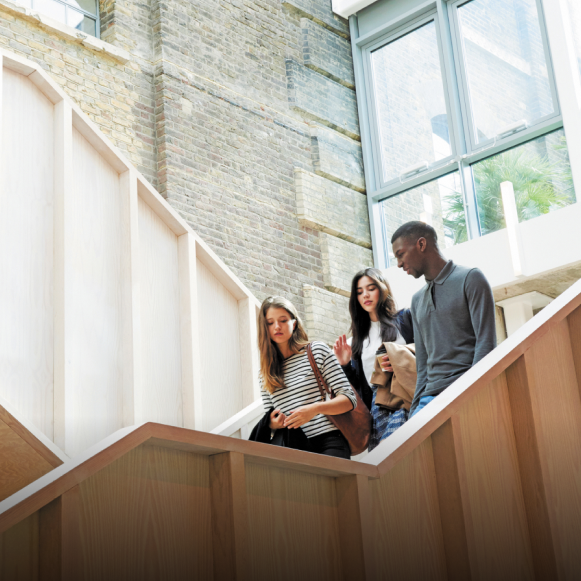 Hult BBA students on stairs in London campus