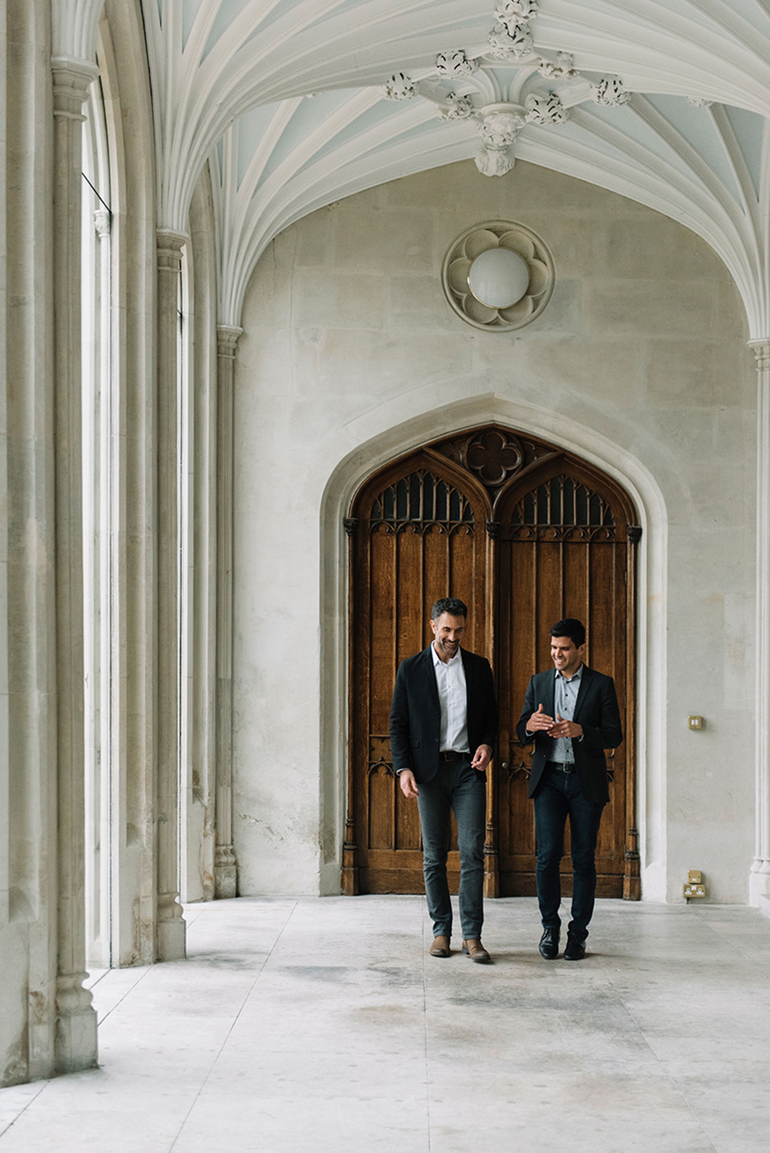 Two people standing outside ashridge building