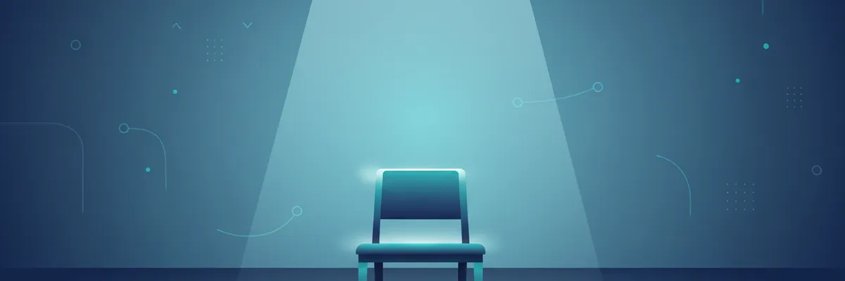 A single empty wooden desk chair positioned at the center of a vast open floor plan office, lit by one overhead beam of natural light, everything else in shadow. Clean, minimal, architectural.