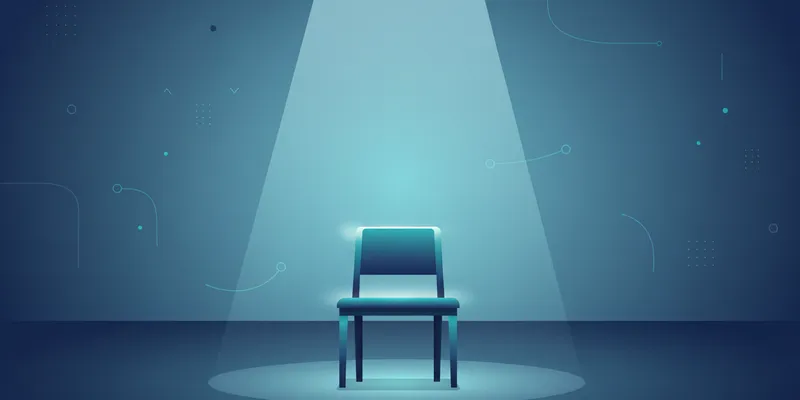 A single empty wooden desk chair positioned at the center of a vast open floor plan office, lit by one overhead beam of natural light, everything else in shadow. Clean, minimal, architectural.