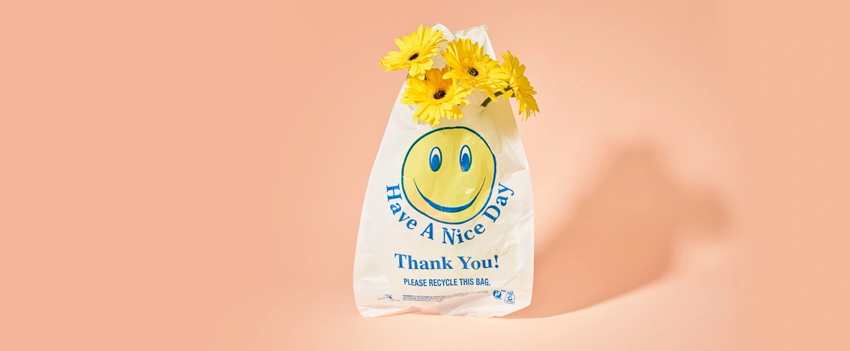 header - smiley - plastic zak - bloemen - tom ten seldam