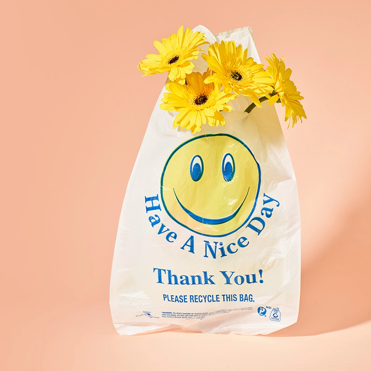 header - smiley - plastic zak - bloemen - tom ten seldam