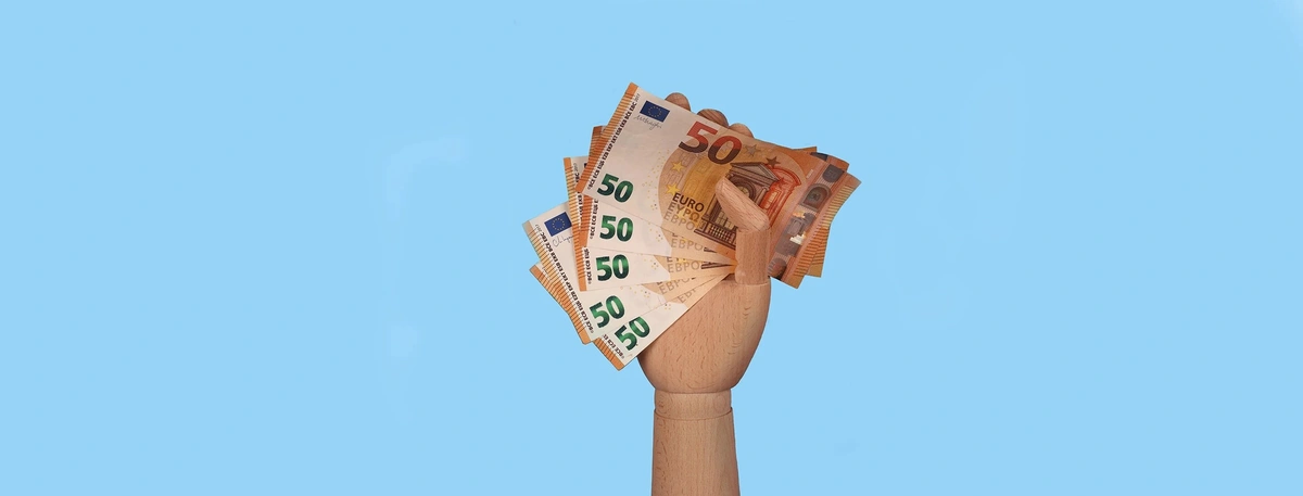 header - geld - hand - unsplash