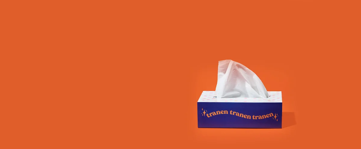 Een doos tissues met het woord tranen erop
