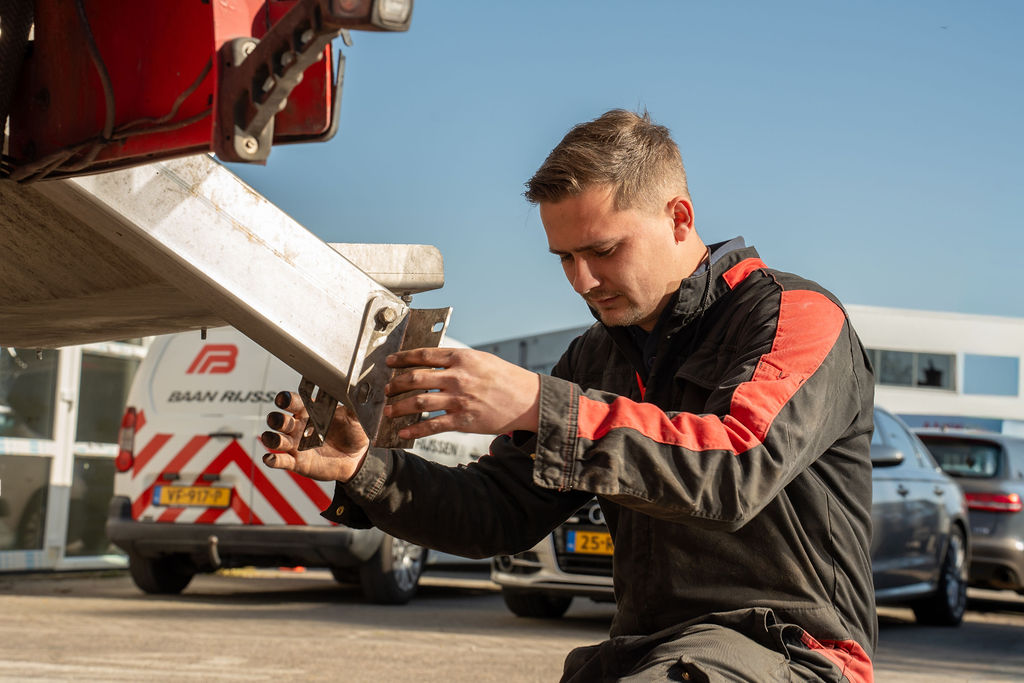 Truck mechanic working in the Baan Rijssen Transporten workshop on truck maintenance