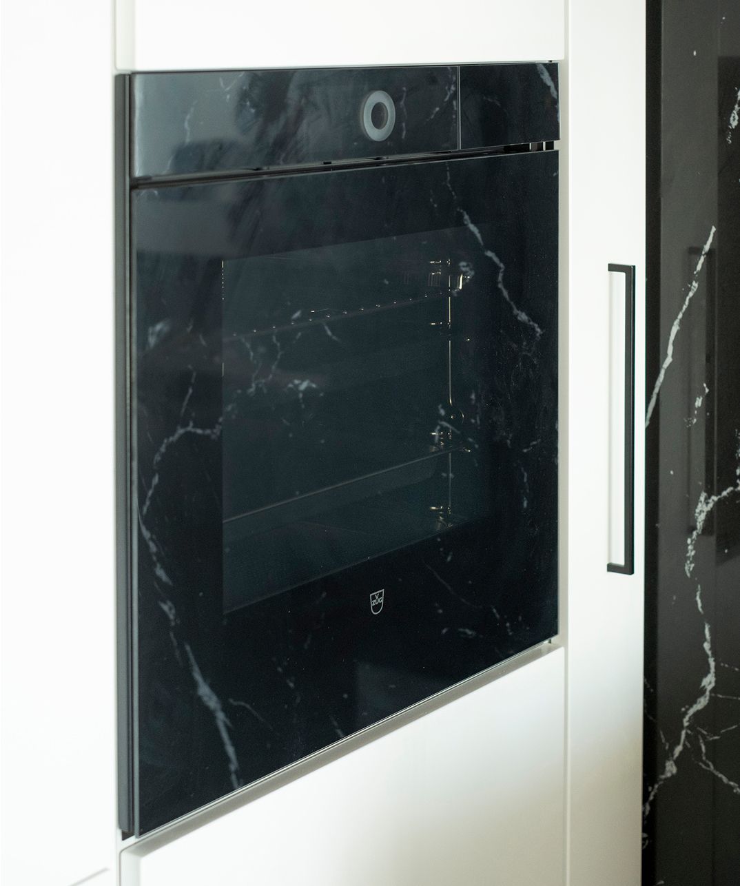 Oven, refrigerator and sink in one working line, black-and-white kitchen in Sayaneh