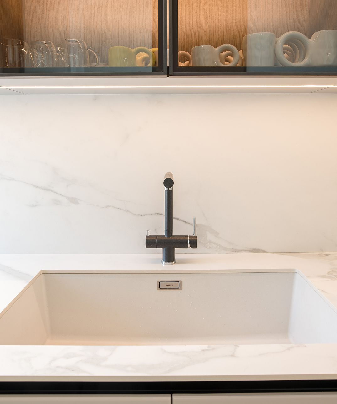 Clean-lined kitchen cabinetry with integrated storage, Cornet Chehwan