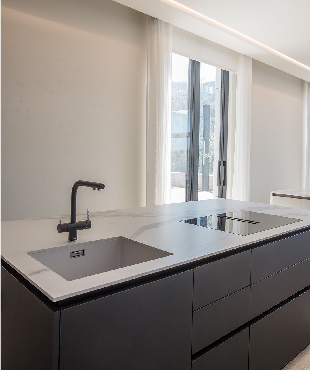 Flush V-ZUG appliances in a frozen walnut kitchen, Cornet Chehwan