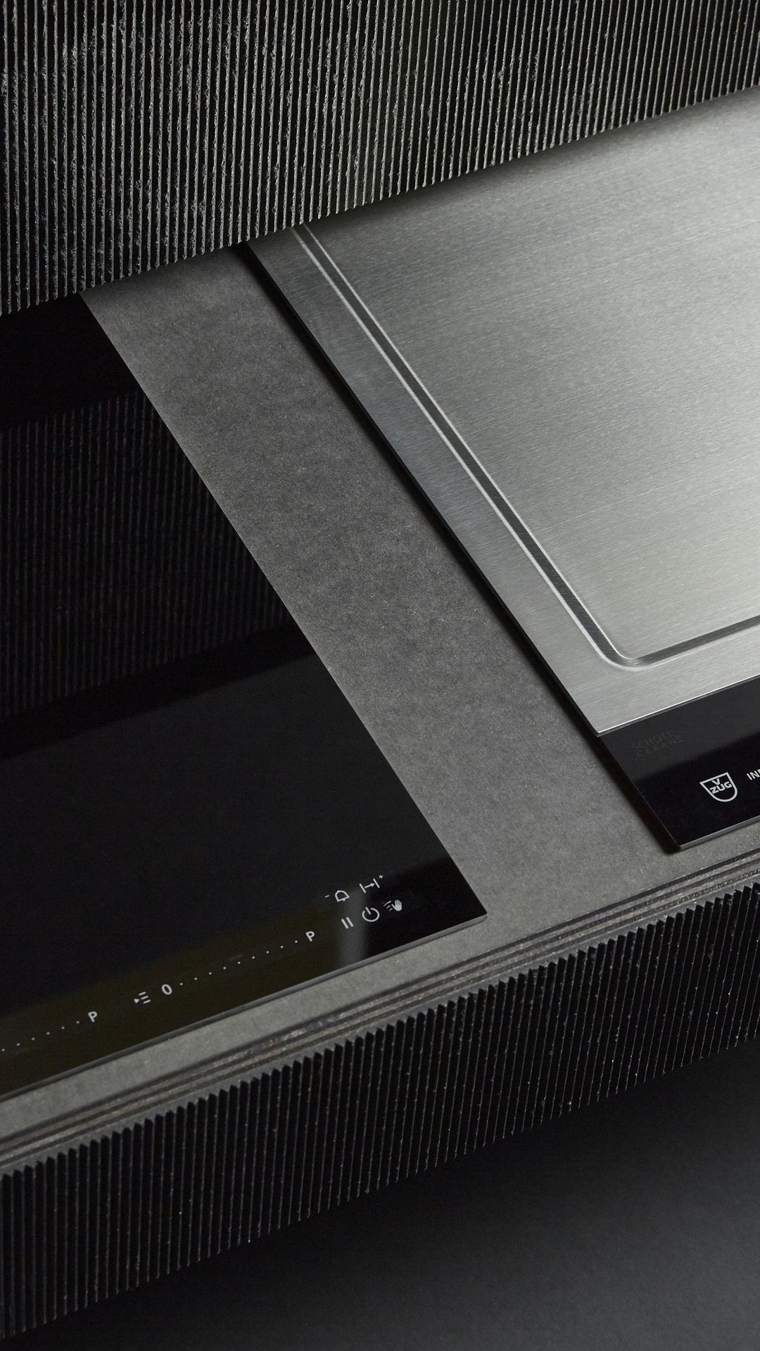 Close-up of an induction hob and steamer with a high-quality design.
