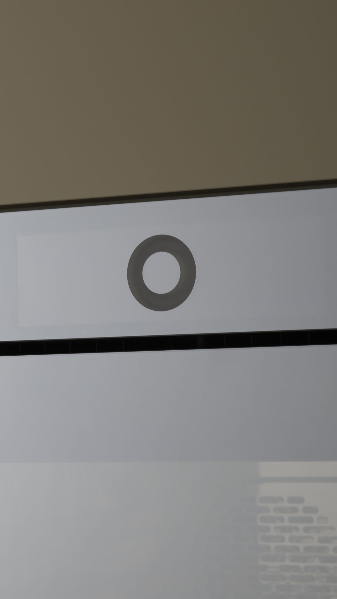 Detailed view of an oven door with an elegant and minimalist design.