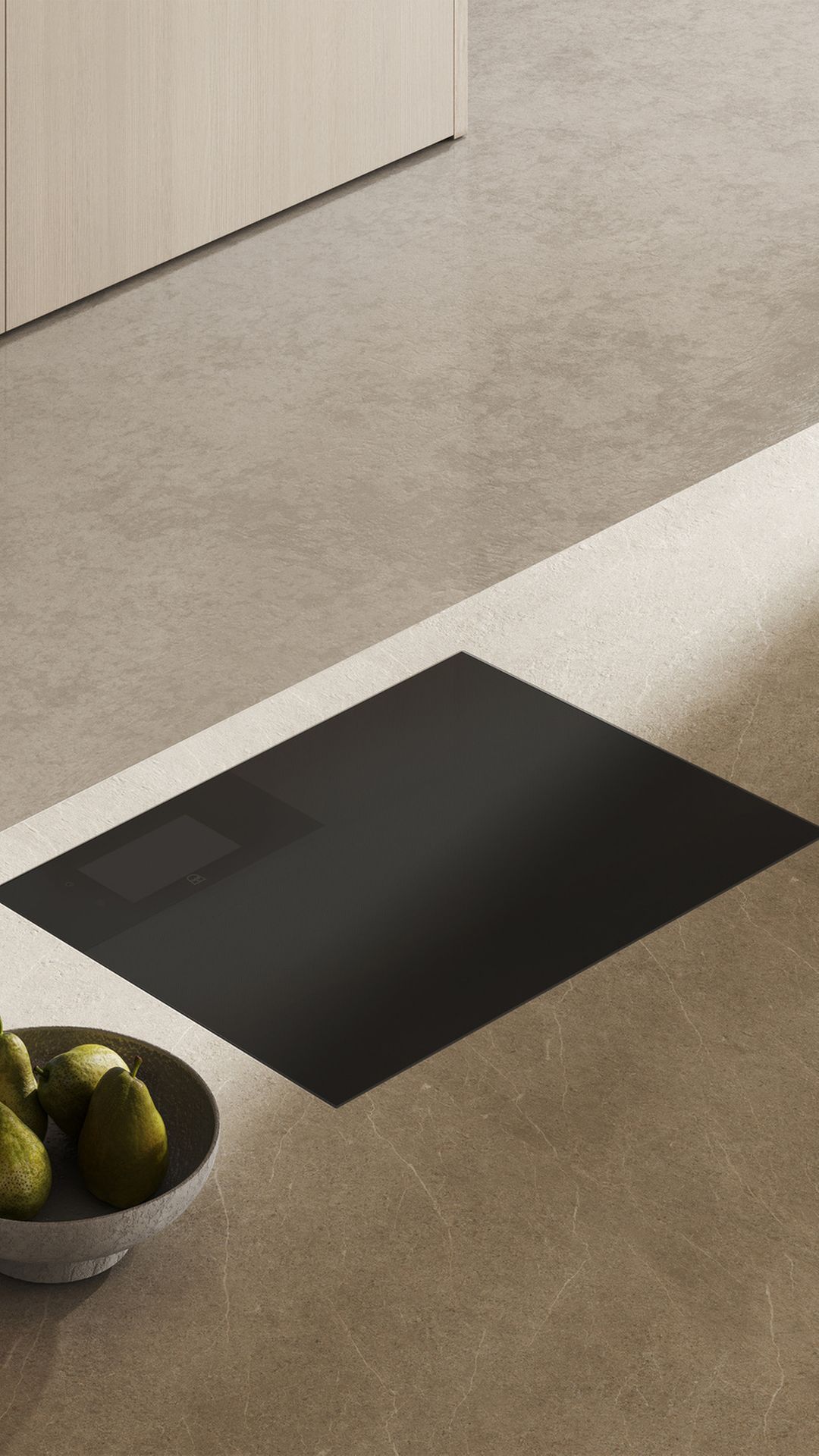 Modern hob in a stylish kitchen with minimalist furnishings and an elegant worktop.