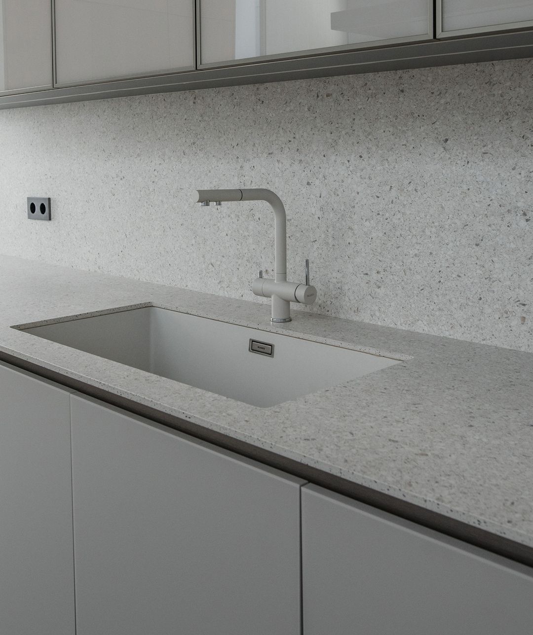 Frozen walnut cabinetry against Crystal Sabbia surfaces, Cornet Chehwan