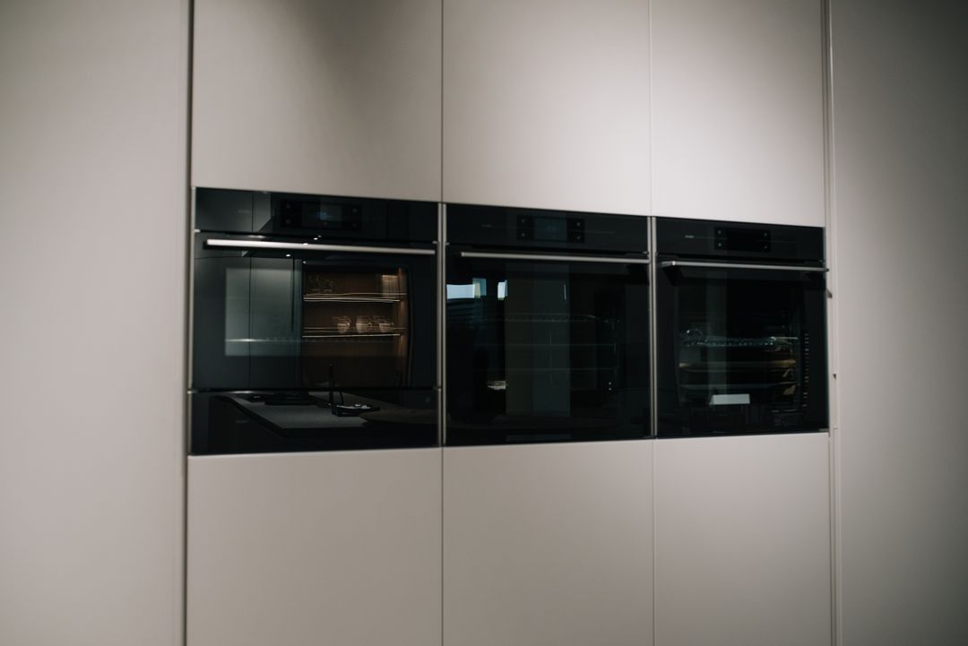 Integrated ASKO ovens with LeMans accessories and Tandem pantry system, Kitchen Avenue showroom