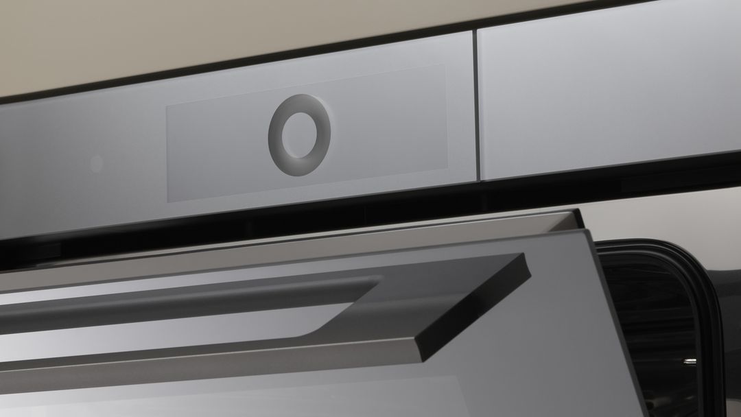 Close-up of a modern oven with open door and elegant design.