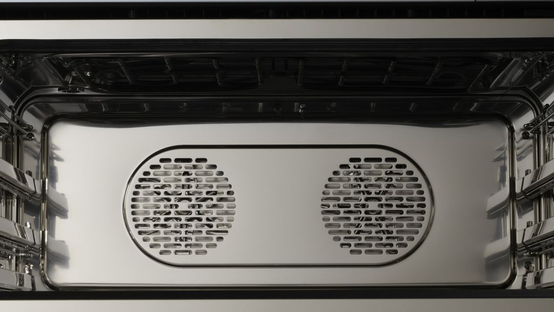 Interior of a modern oven with stainless steel and innovative technology.