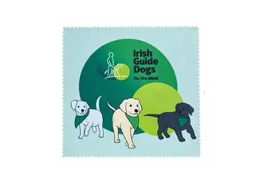 Logo of Irish Guide Dogs for the Blind featuring three illustrated puppies in front of green circles.