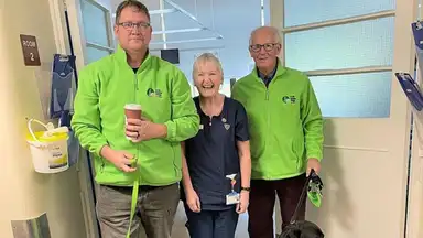 Chair of Galway IGD Kevin Quinn and John Gannon, (Branch Treasurer) with dogs Ulmer and Ash and a member of hospital staff during a hospital visit in Galway