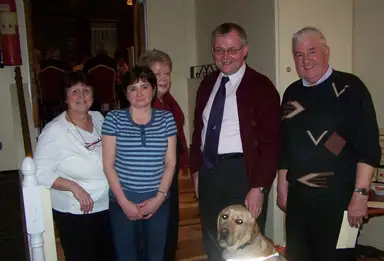 Garristown Poker Night with Barbara Reid (owner of Garristown House), Ann Beggs, Phyllis Mangan, Tom, Dick Cashen, and Guide Dog Sarge in front.