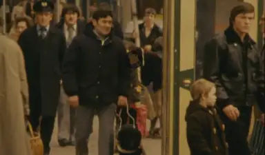 Pat walking with Turk in a crowded area