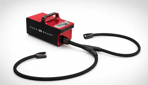 Red and black Game Ready control unit with control display, fitted with dual connector hoses.