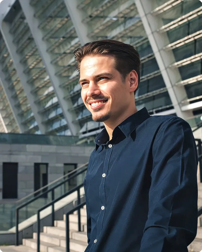 Professional in a modern-city stairs setting representing the On-Location Brand mode (the team's actual outdoor environment)