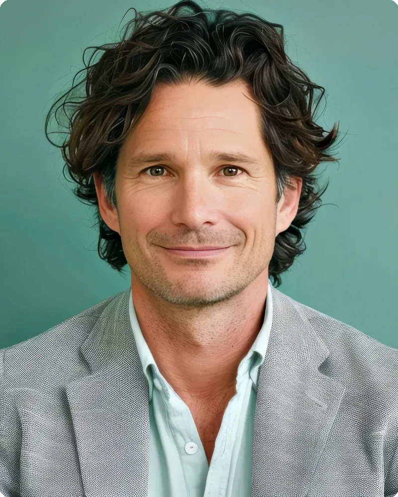 Smiling man in brand-color teal background portrait, representing the Brand-Forward mode